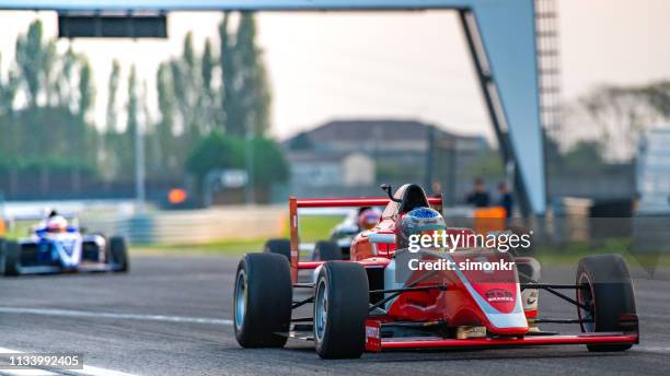 man driving formula racing car - athletics grand prix stock pictures, royalty-free photos & images