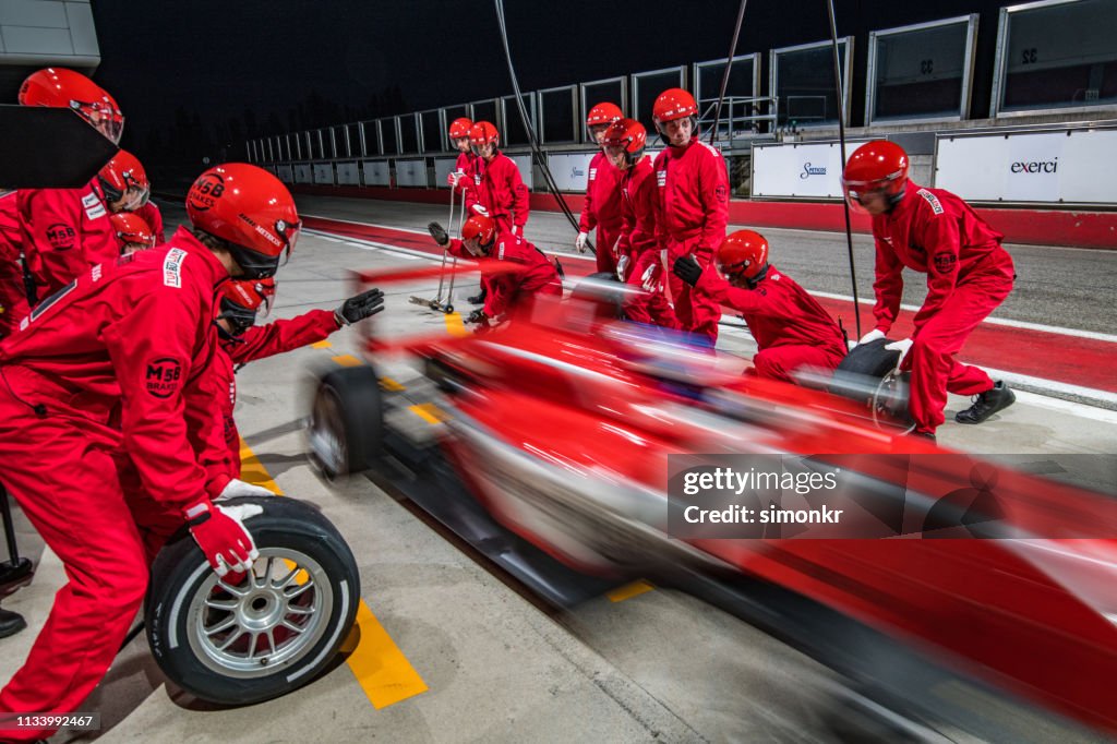 Racing team working at pit stop