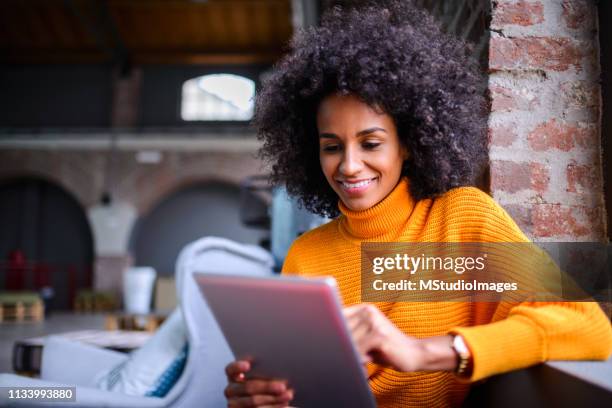 smiling woman using digital tablet. - cell cultures stock pictures, royalty-free photos & images
