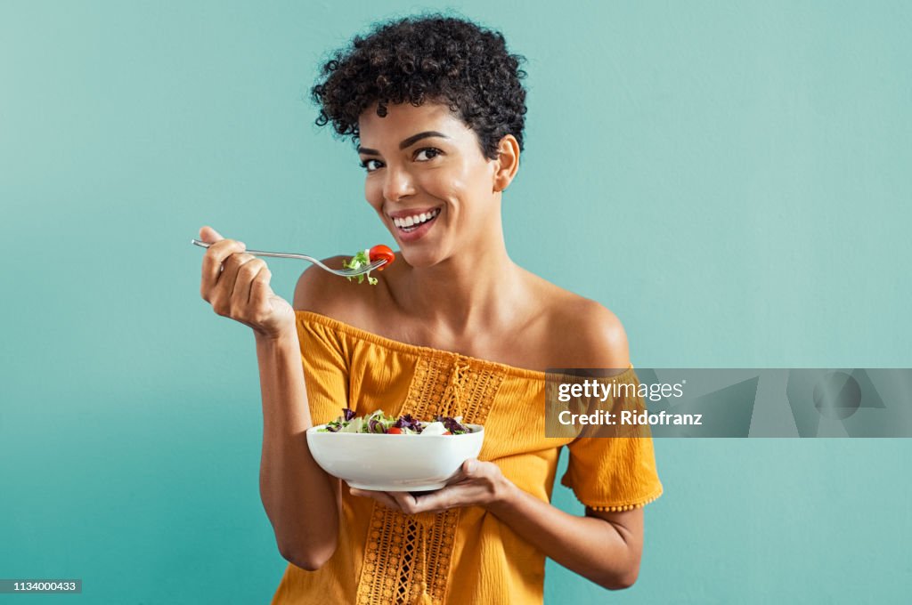 Woman eating salad