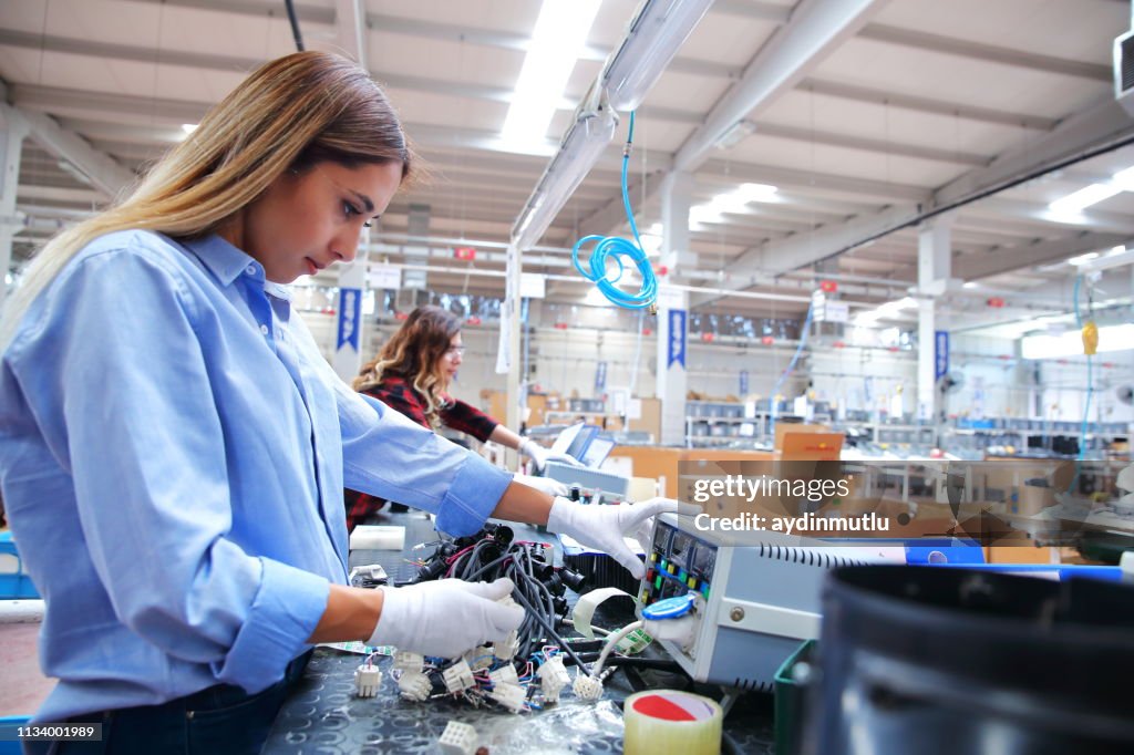 Factory Hand Labourer Manual Workers Working At A Factory High-Res Stock Photo - Getty Images