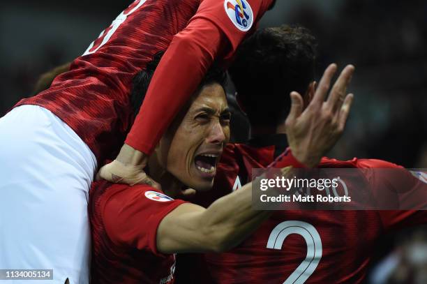 Ryota Moriwaki of Urawa Red Diamonds celebrates with team mates after a goal by Tomoaki Makino during the AFC Champions League Group G match between...