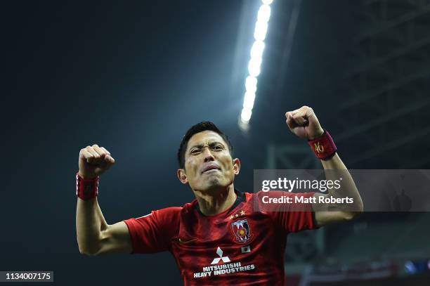 Ryota Moriwaki of Urawa Red Diamonds celebrates a goal by Tomoaki Makino during the AFC Champions League Group G match between Urawa Red Diamonds and...