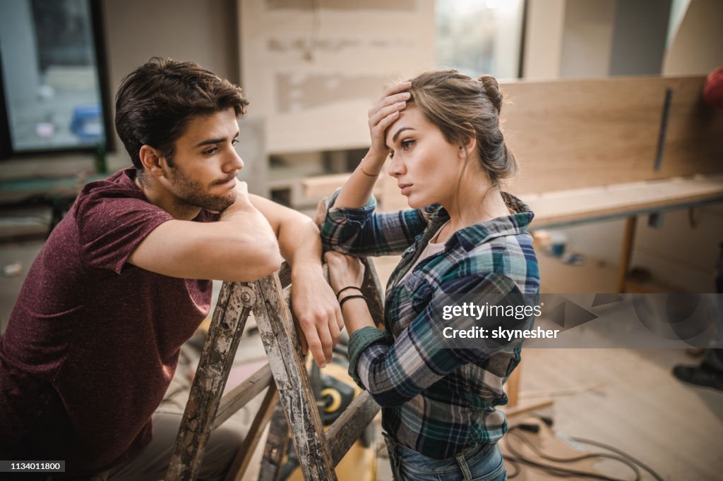 Young couple having problems while renovating their apartment.