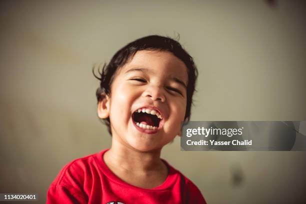 asian boy laughing - two young boys foto e immagini stock