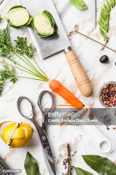 kitchen tools in action, vertical - peeling food stock pictures, royalty-free photos & images