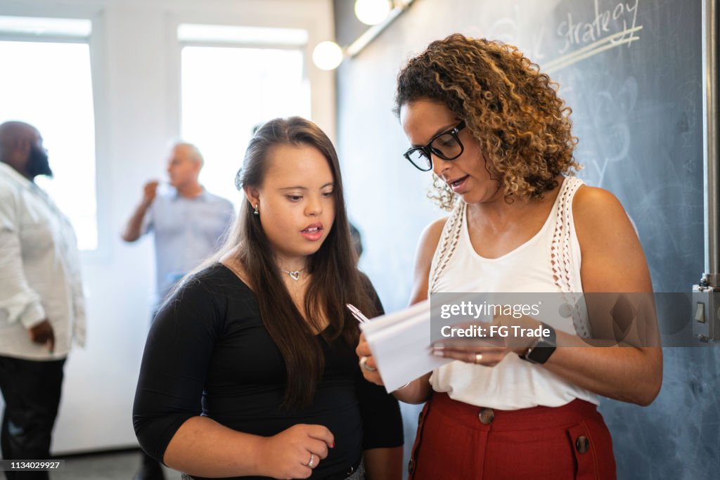 Special Needs Woman learning with leadership at startup company