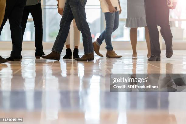 unrecognizable business people in office lobby - work shoe stock pictures, royalty-free photos & images