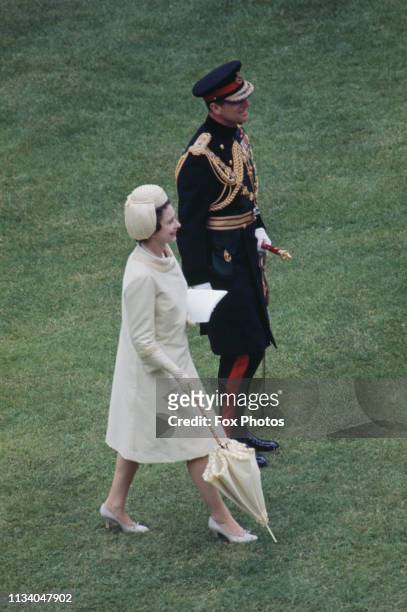 Queen Elizabeth II and Prince Philip, Duke of Edinburgh at the investiture of Prince Charles as Prince of Wales at Caernarfon Castle, Gwynedd, Wales,...