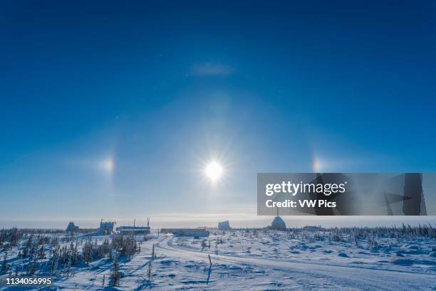 Sundogs over the old Churchill Rocket Range, Churchill, Manitoba on a clear and cold winter day with ice crystals in the air With the 20mm SIgma lens.