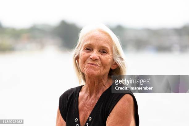 portrait of disguste old woman, outdoor, background with copy space - very ugly women imagens e fotografias de stock