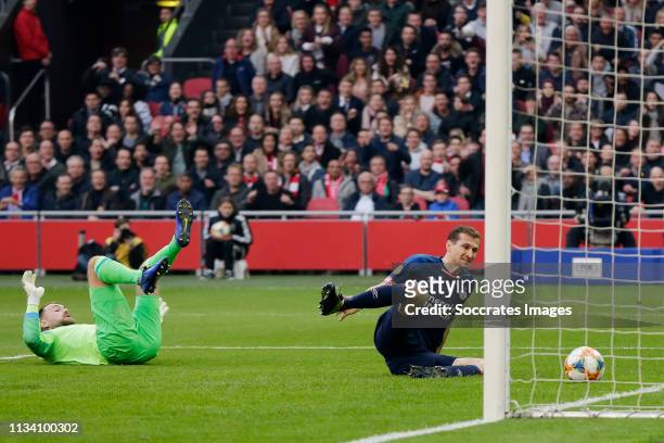 Daniel Schwaab of PSV scores a own goal to make it 1-0 during the Dutch Eredivisie match between Ajax v PSV at the Johan Cruijff Arena on March 31,...