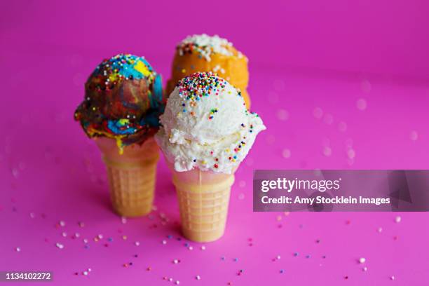three ice cream cones with sprinkles - scoop shape stock pictures, royalty-free photos & images