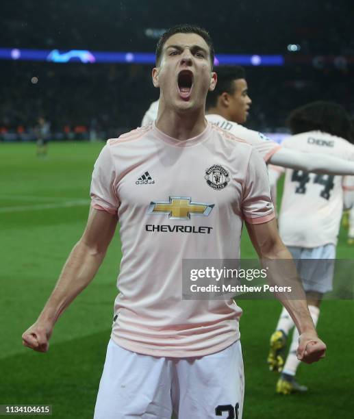 Diogo Dalot of Manchester United celebrates Marcus Rashford scoring their third goal during the UEFA Champions League Round of 16 Second Leg match...