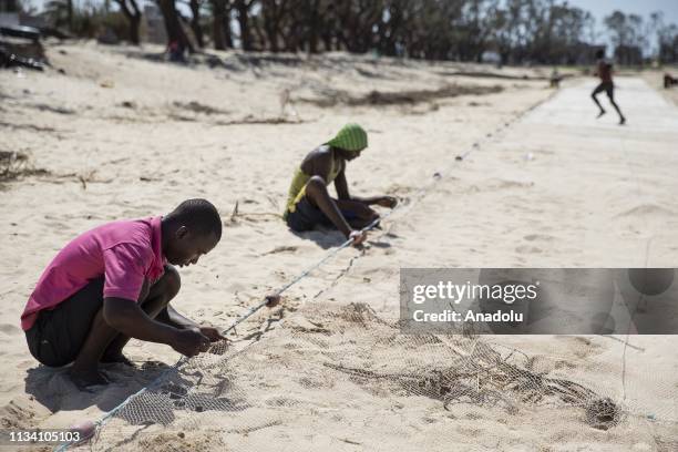 Mozambiqueans are seen following the Cyclone Idai in Sofala region in Beira, Mozambique on March 31, 2019. Cyclone Idai made landfall in Beira on...