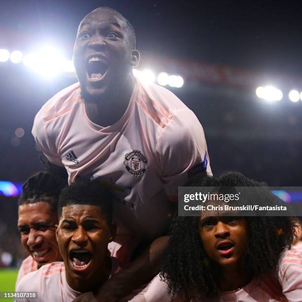 Marcus Rashford of Manchester United celebrates scoring his side's third goal with team-mates Romelu Lukaku and Tahith Chong during the UEFA...