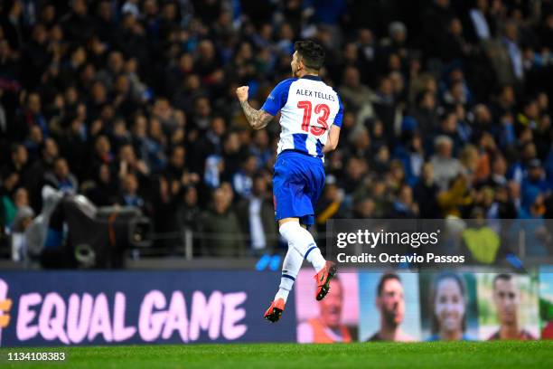 Alex Telles of FC Porto celebrates after scoring his sides third goal during the UEFA Champions League Round of 16 Second Leg match between FC Porto...