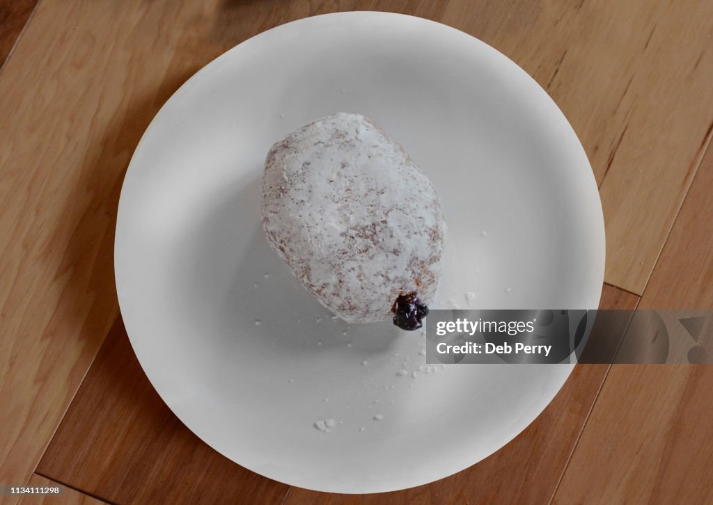 Close up photo of a pączki (paczki) pastry