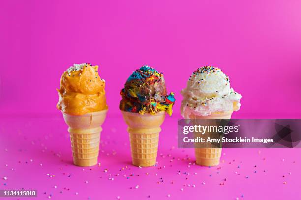 three ice cream cone varieties in a row - cucchiaio dosatore foto e immagini stock