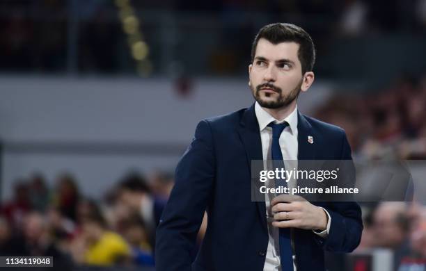 March 2019, Bavaria, Bamberg: Basketball: Bundesliga, Brose Bamberg - ALBA Berlin, main round, 26th matchday: Bamberg's coach Federico Perego follows...