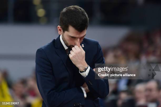 March 2019, Bavaria, Bamberg: Basketball: Bundesliga, Brose Bamberg - ALBA Berlin, main round, 26th matchday: Bamberg's coach Federico Perego touches...