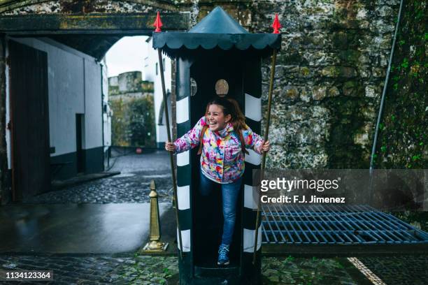 woman having fun in sentry box in ponta delgada, azores islands. - azores people stock pictures, royalty-free photos & images