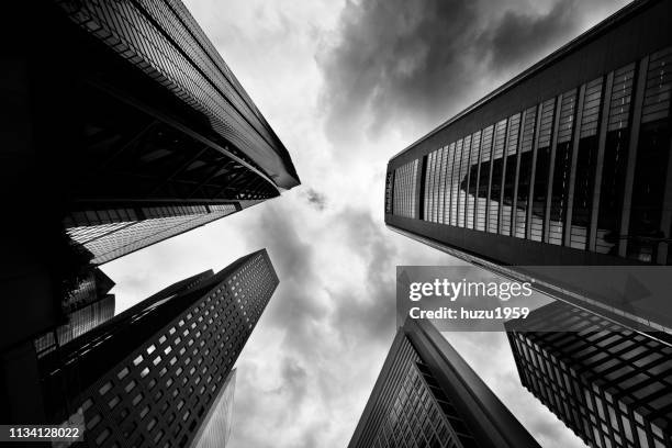 upward view of skyscrapers - 近未来的 stock-fotos und bilder