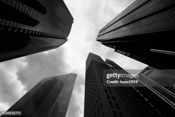upward view of skyscrapers - 現代的 stock pictures, royalty-free photos & images