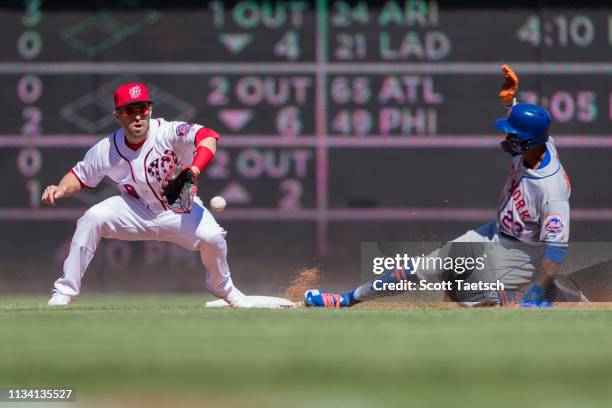 Keon Broxton of the New York Mets steals second base in front of Brian Dozier of the Washington Nationals during the inning at Nationals Park on...