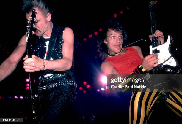 German Rock musicians Rudolf Schenker and Matthias Jabs, both on guitar for the group Scorpions, perform onstage at the Rosemont Horizon, Rosemont,...