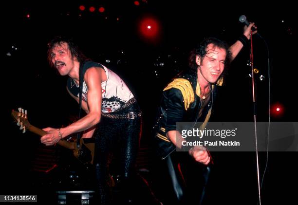 German Rock musician Rudolf Schenker , on guitar, and vocalist Klaus Meine, both of the group Scorpions, perform onstage at the Rosemont Horizon,...