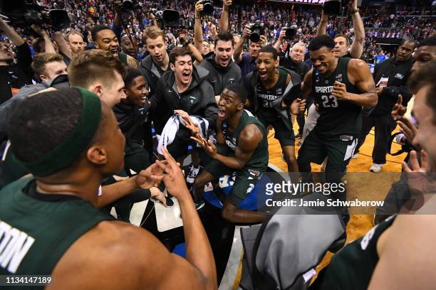 The Michigan State Spartans celebrate their victory over the Duke Blue Devils in the Elite Eight round of the 2019 NCAA Photos via Getty Images Men's...