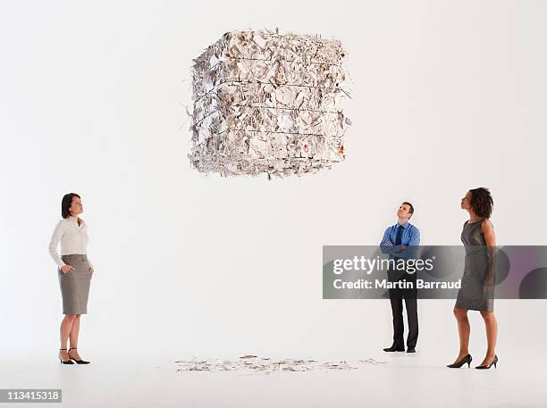 business people looking at floating paper bale - small group of people white background stock pictures, royalty-free photos & images