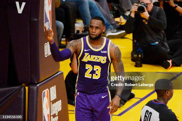 LeBron James of the Los Angeles Lakers celebrates after passing Michael Jordan and moving to on the NBA's all-time scoring list during the second...