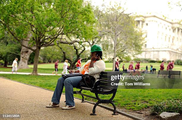 Stephanie Thomas of Mississippi, sits on the west front of the Capitol while on the Hill to lobby offices with the group Power Shift 2011, to call on...