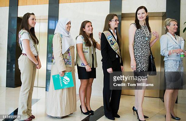 From left Girl Scouts Maggie Burgos, Abrar Omeish, Katie McGrath, and Carloine Tyding, actor Geena Davis, and former FCC Commissioner Debi Tate, line...
