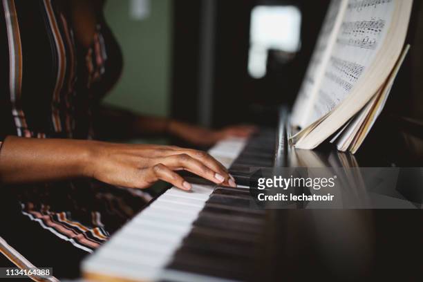 close up on the hands of a piano player - piano stock pictures, royalty-free photos & images