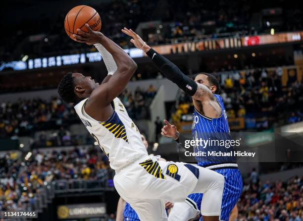 Darren Collison of the Indiana Pacers shoots the ball against D.J. Augustin of the Orlando Magic at Bankers Life Fieldhouse on March 30, 2019 in...
