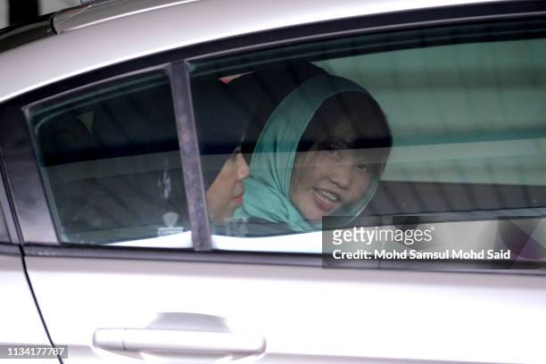 Vietnamese Doan Thi Huong, as she smiles inside the police car after a court session for her trial at the Shah Alam High Court for murder case of Kim...