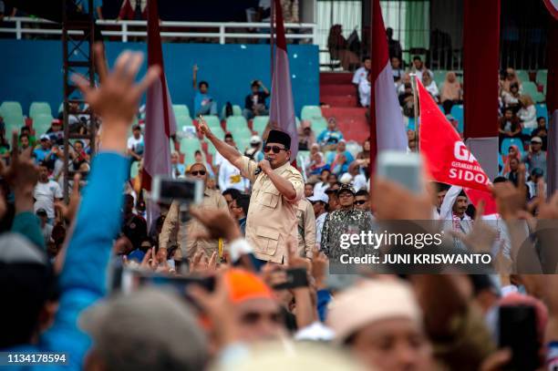 This picture taken on March 31, 2019 shows Indonesian presidential candidate Prabowo Subianto, a former military general, greeting his supporters in...