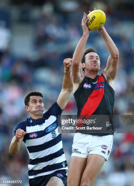 Mitch Brown of the Bombers and Jed Bews of the Cats compete for the ball during the 2019 JLT Community Series AFL match between the Geelong Cats and...