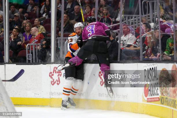 Lehigh Valley Phantoms right wing Colin McDonald and Cleveland Monsters defenceman Tommy Cross go into the boards as they battle for the puck during...