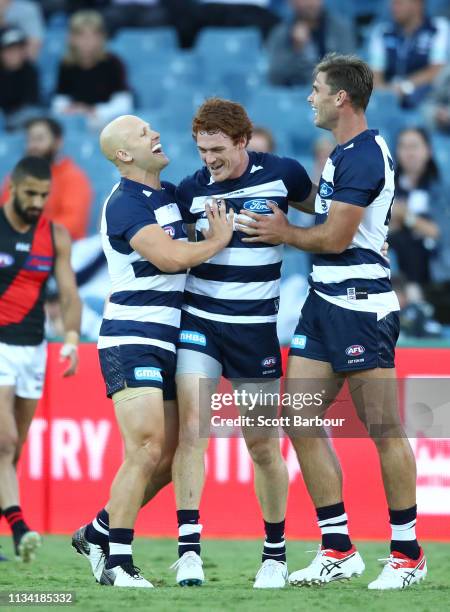 Gary Rohan of the Cats is congratulated by Gary Ablett of the Cats and Tom Hawkins of the Cats after kicking a goal during the 2019 JLT Community...