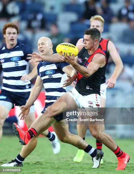 Gary Ablett of the Cats and Conor McKenna of the Bombers compete for the ball during the 2019 JLT Community Series AFL match between the Geelong Cats...