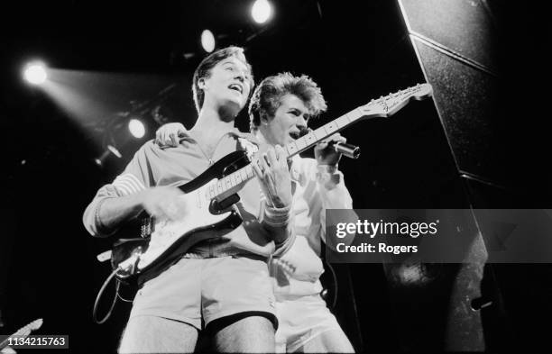 British singer-songwriters George Michael and Andrew Ridgeley of pop duo Wham performing at the Lyceum Theatre during the Club Fantastic Tour,...