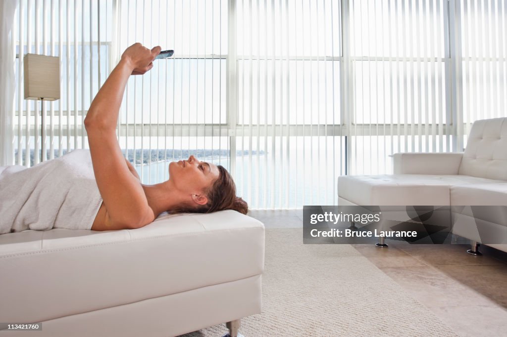 Woman texting at home