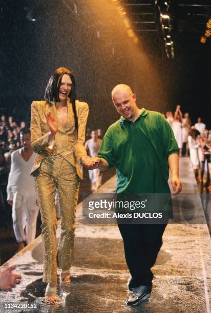 Alexander McQueen with a model at his London Spring/Summer Collection fashion show on September 28 in London, United Kingdom.