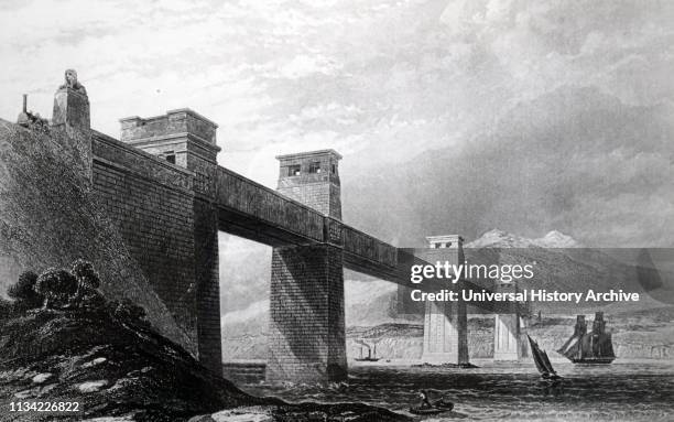 Illustration. Showing the Britannia tubular bridge. Over the Menai Straits. Into position. Begun by Robert Stephenson in 1846. The bridge was opened...