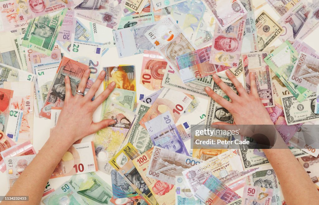 Hands counting foreign currency