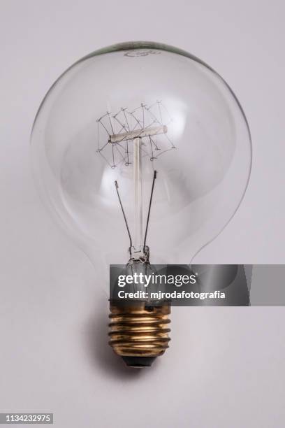 close-up of light bulb against white background - imaginación bildbanksfoton och bilder